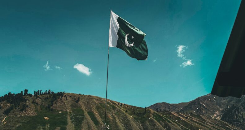 a pakistan flag on a pole